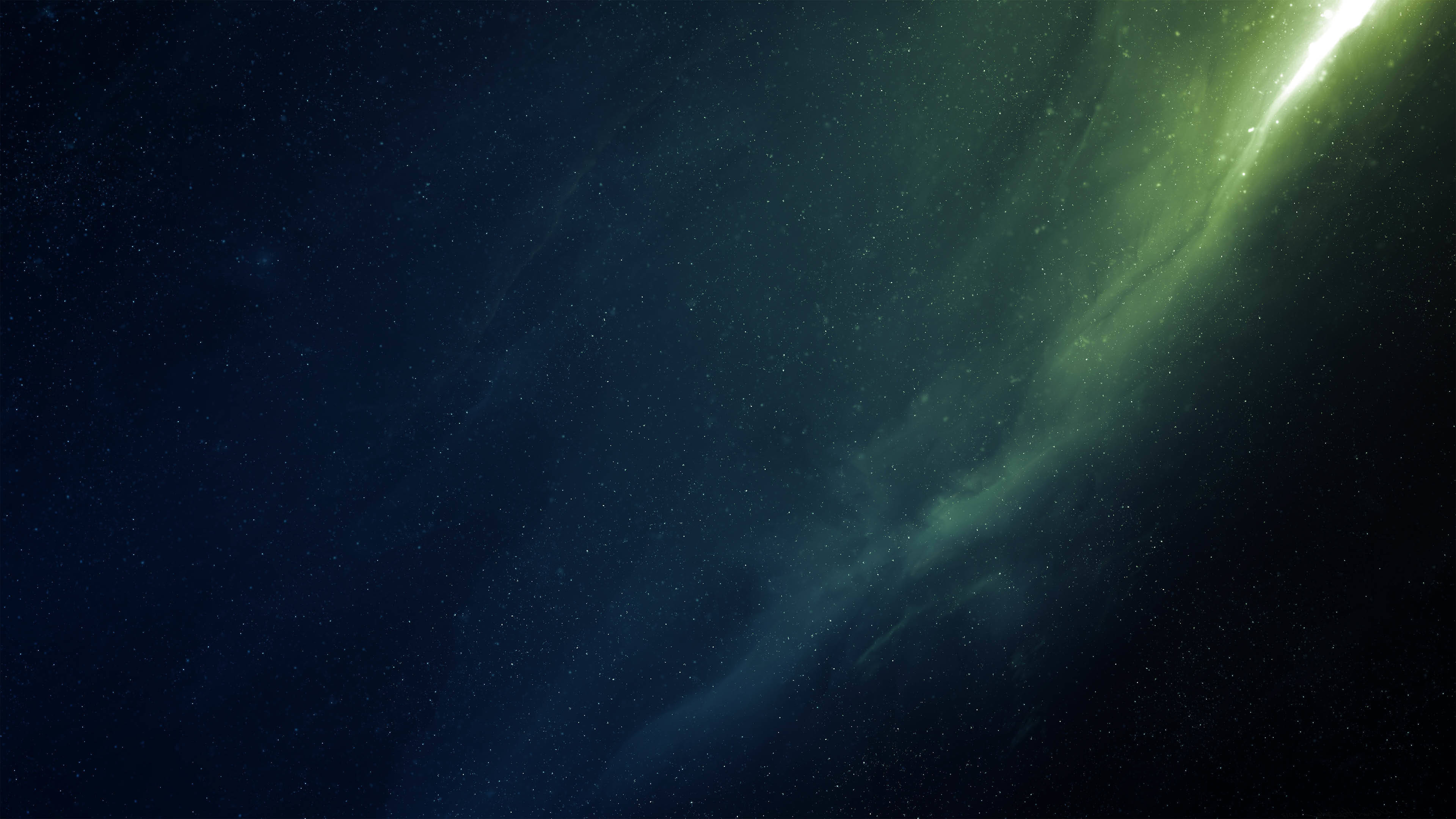 銀河 桌布 壁紙 — 一道明亮的綠色星雲劃過深空中佈滿星辰的宇宙虛空。