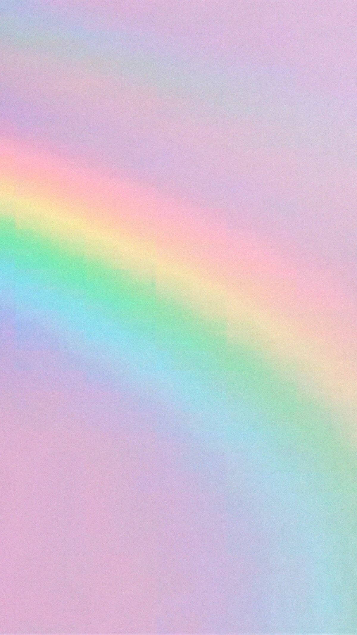Gradient 桌布 壁紙 — 一道柔和的粉彩彩虹優雅地拱起，橫跨一個夢幻的漸變天空，混合了粉紅、薰衣草和薄荷綠色調。