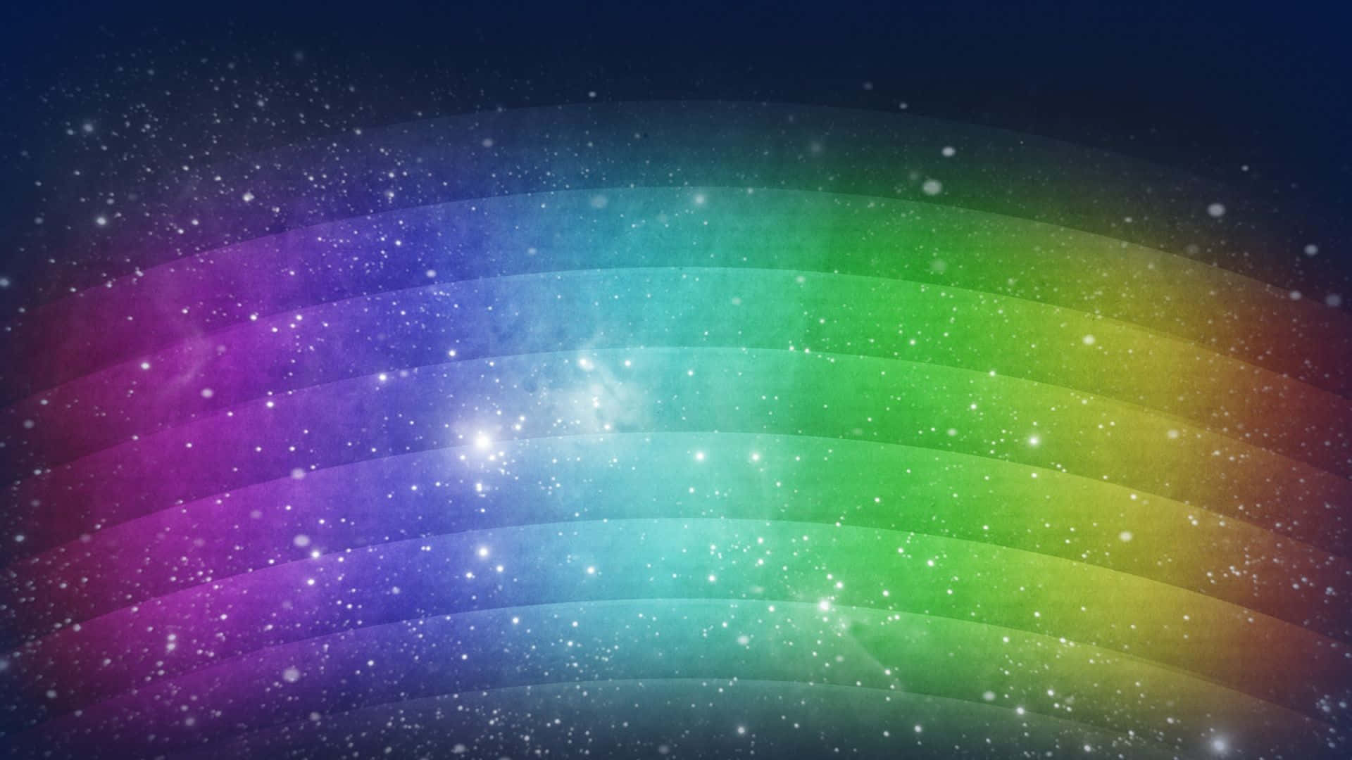 Rainbow Colours 桌布 壁紙 — 一道鮮豔的彩虹橫跨佈滿星星的宇宙天空，伴隨著發光的星雲和閃爍的粒子。