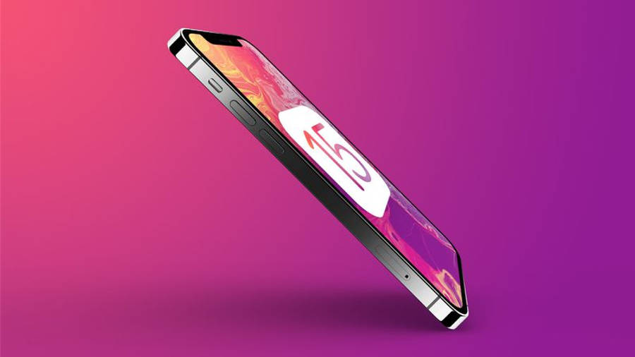 iOS 15 桌布 壁紙 — 一部時尚智慧型手機在充滿活力的粉紅和紫色漸變背景上對角漂浮，顯示一個風格化的數字15。