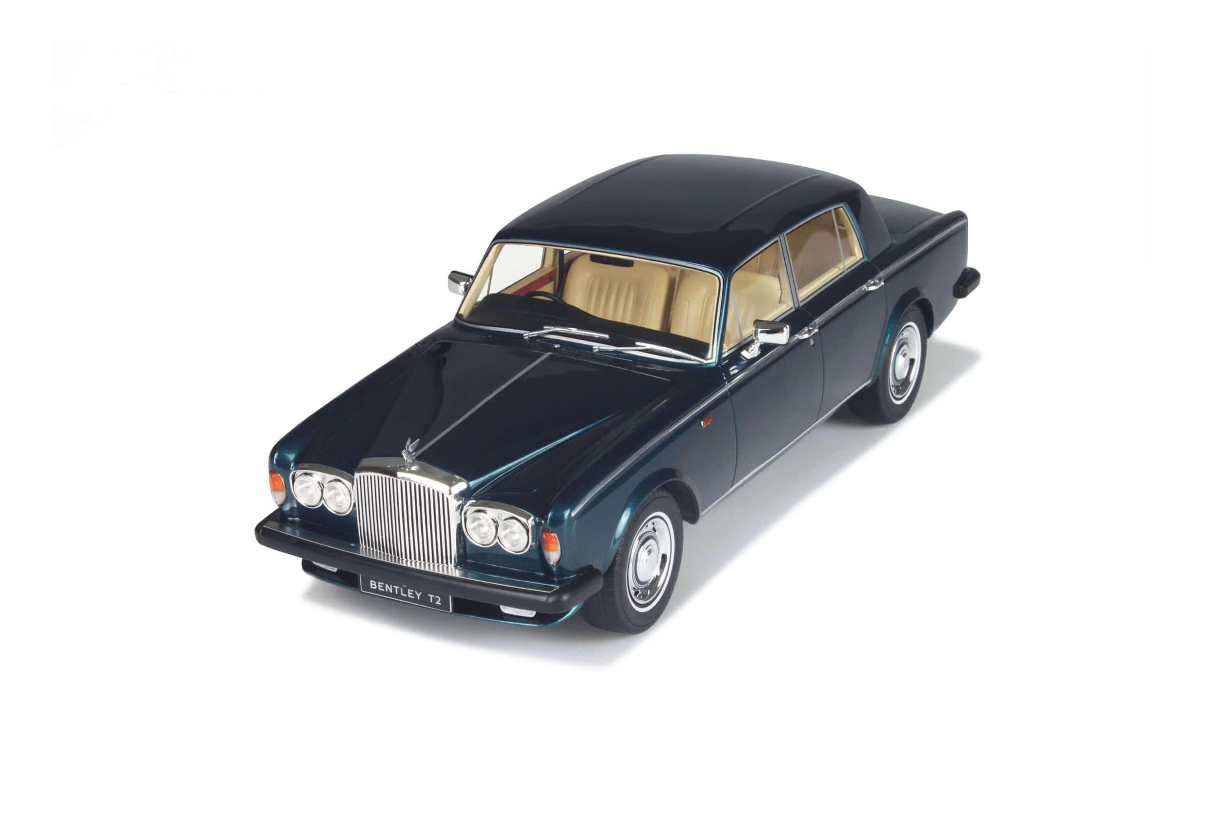 Bentley T2 桌布 壁紙 — 一部時尚深藍色賓利T2模型車，配備米色內裝，展示在潔白背景上。