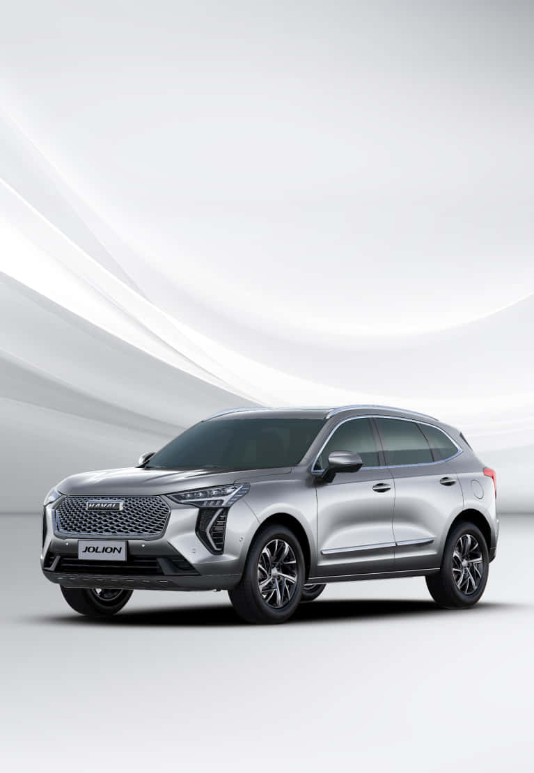 Haval 桌布 壁紙 — 一部時尚的銀色SUV，配備現代LED頭燈和黑色合金輪圈，在極簡的白色弧形背景前展示。