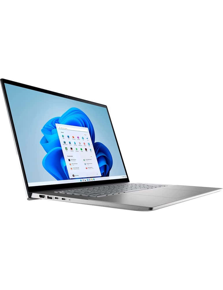 Dell 桌布 壁紙 — 一部時尚的銀色筆記型電腦打開到Windows開始功能表，背景為藍色抽象壁紙。