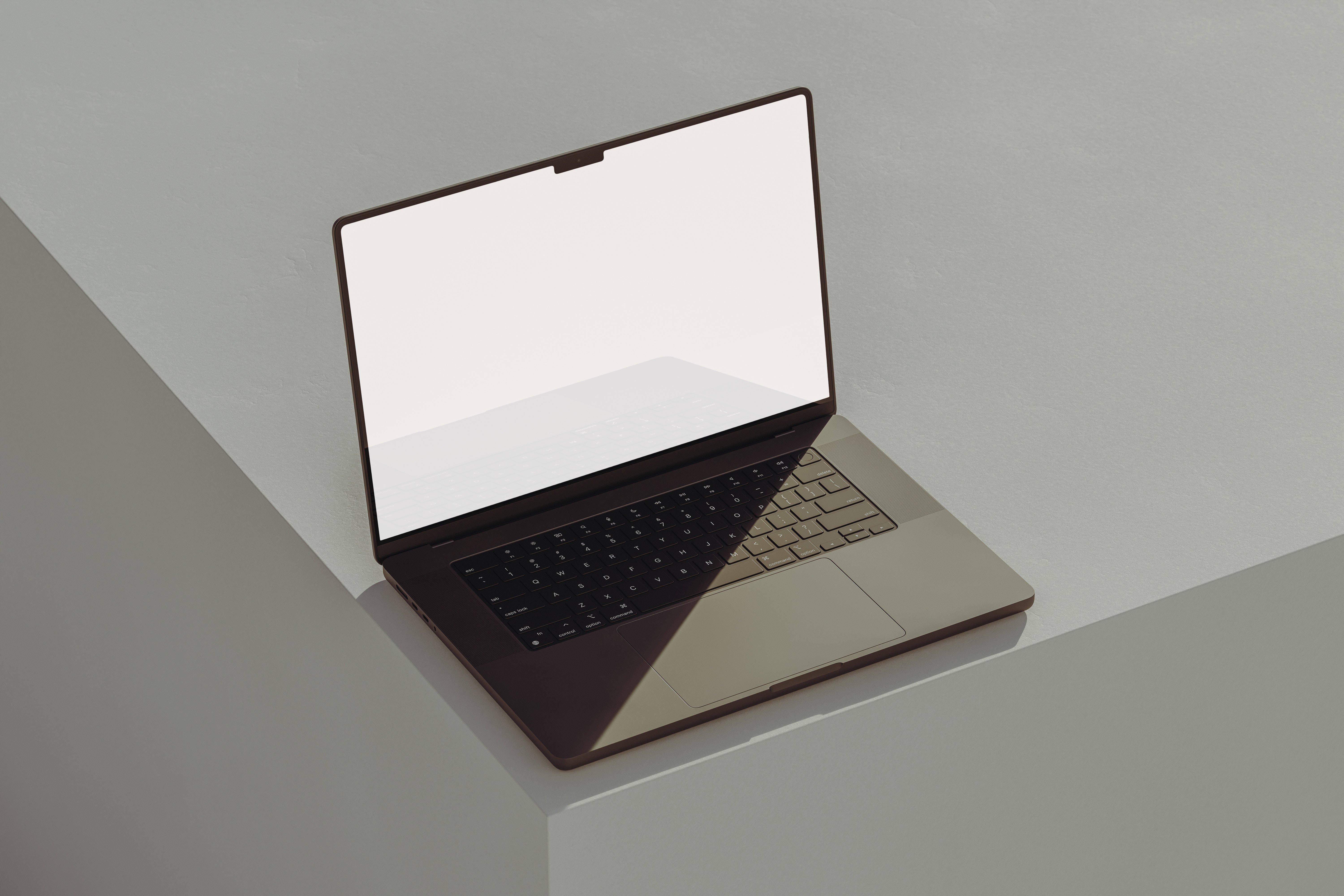 aesthetic tumblr laptop 桌布 壁紙 — 一部時尚的銀色筆記型電腦打開放在簡約的白色架子上，在乾淨的攝影棚燈光下投射出柔和陰影。