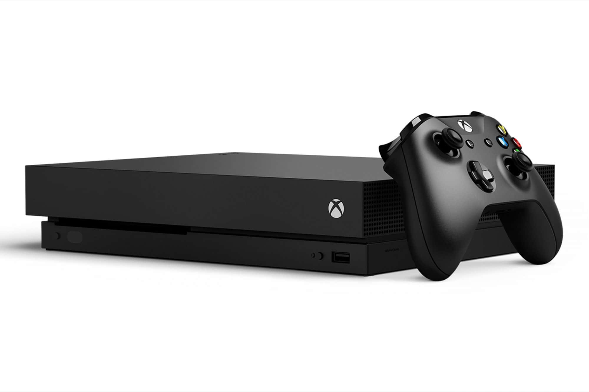 Xbox 桌布 壁紙 — 一部時尚的黑色 Xbox 主機和控制器並排放在潔白的背景上。