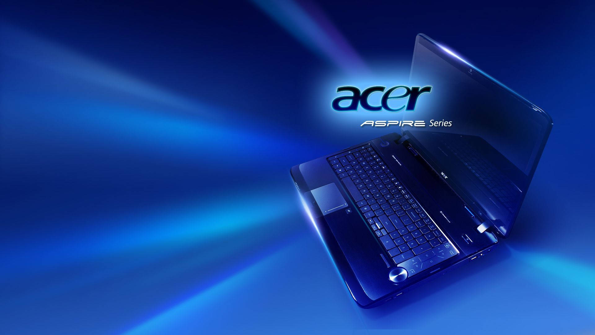 筆電 桌布 壁紙 — 一部時尚的黑色Acer Aspire筆記型電腦在動態藍色漸變背景上散發出耀眼的藍光。