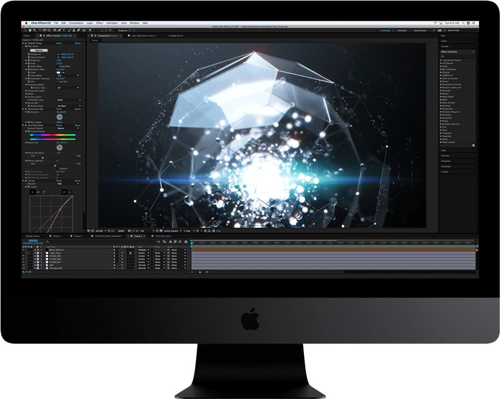 Mac 桌布 壁紙 — 一部纖薄的 iMac 在 Adobe After Effects 中顯示發光的幾何粒子動畫，帶有深色介面面板。