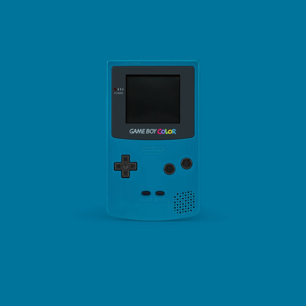 game 桌布 壁紙 — 一部鮮藍色 Game Boy Color 主機置中於純色青綠色背景上，帶有柔和陰影。