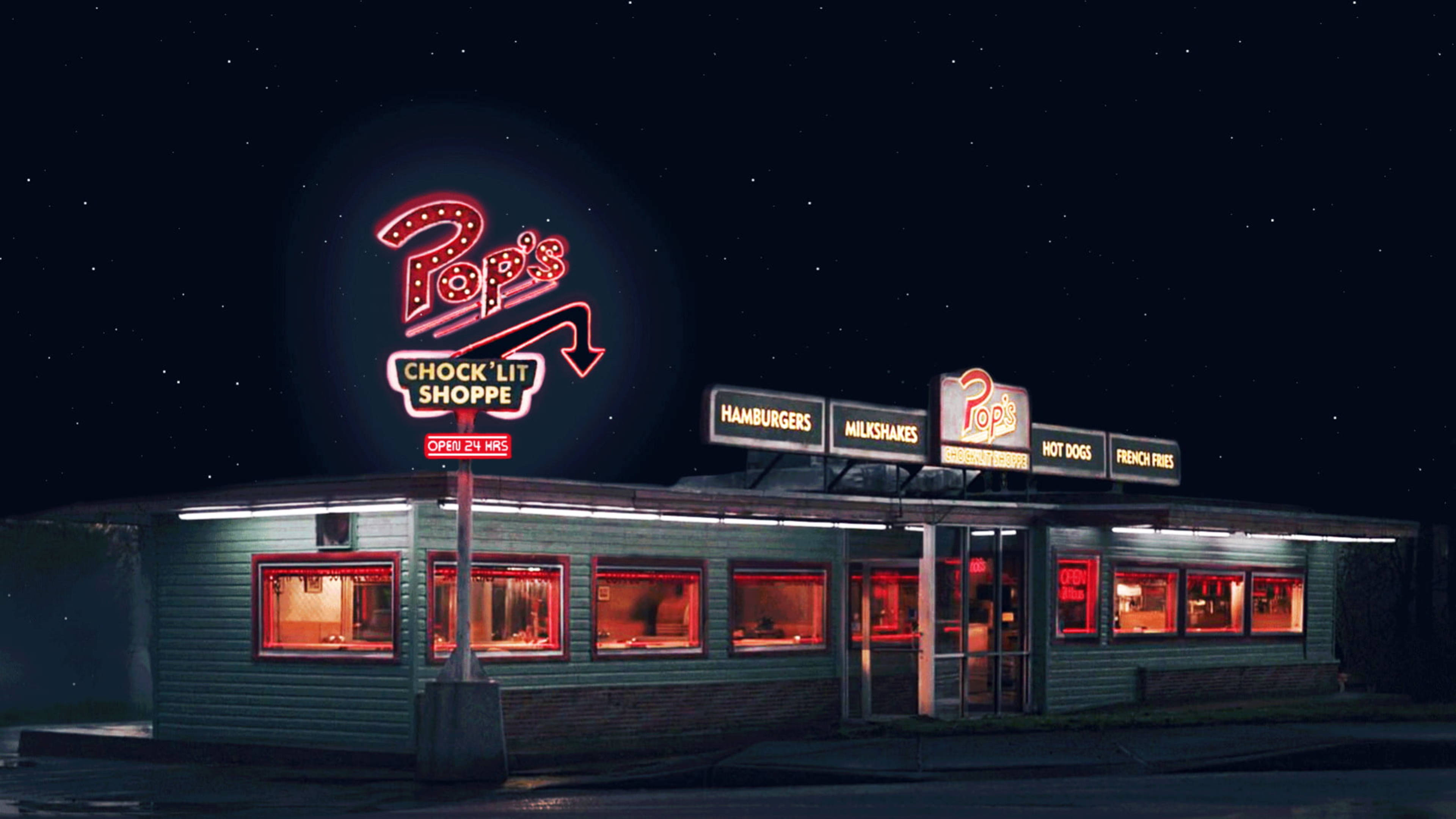 Riverdale 桌布 壁紙 — 一間名為 Pop's Chock'lit Shoppe 的復古餐廳在星空下閃耀，霓虹燈牌和溫暖的室內燈光交相輝映。