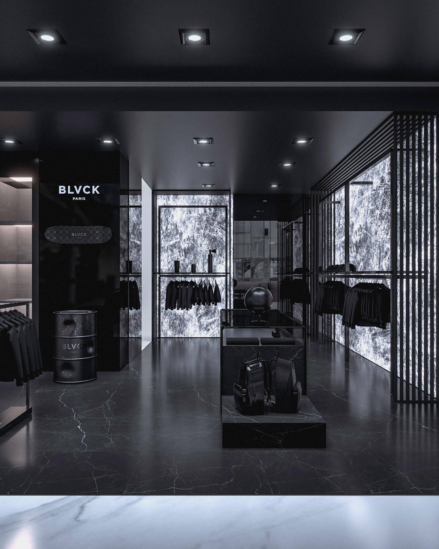 Blvck Paris 桌布 壁紙 — 一間時尚簡約的服裝店，鋪有黑色大理石地板和牆壁，由嵌入式天花板燈和發光的紋理背光板照明。