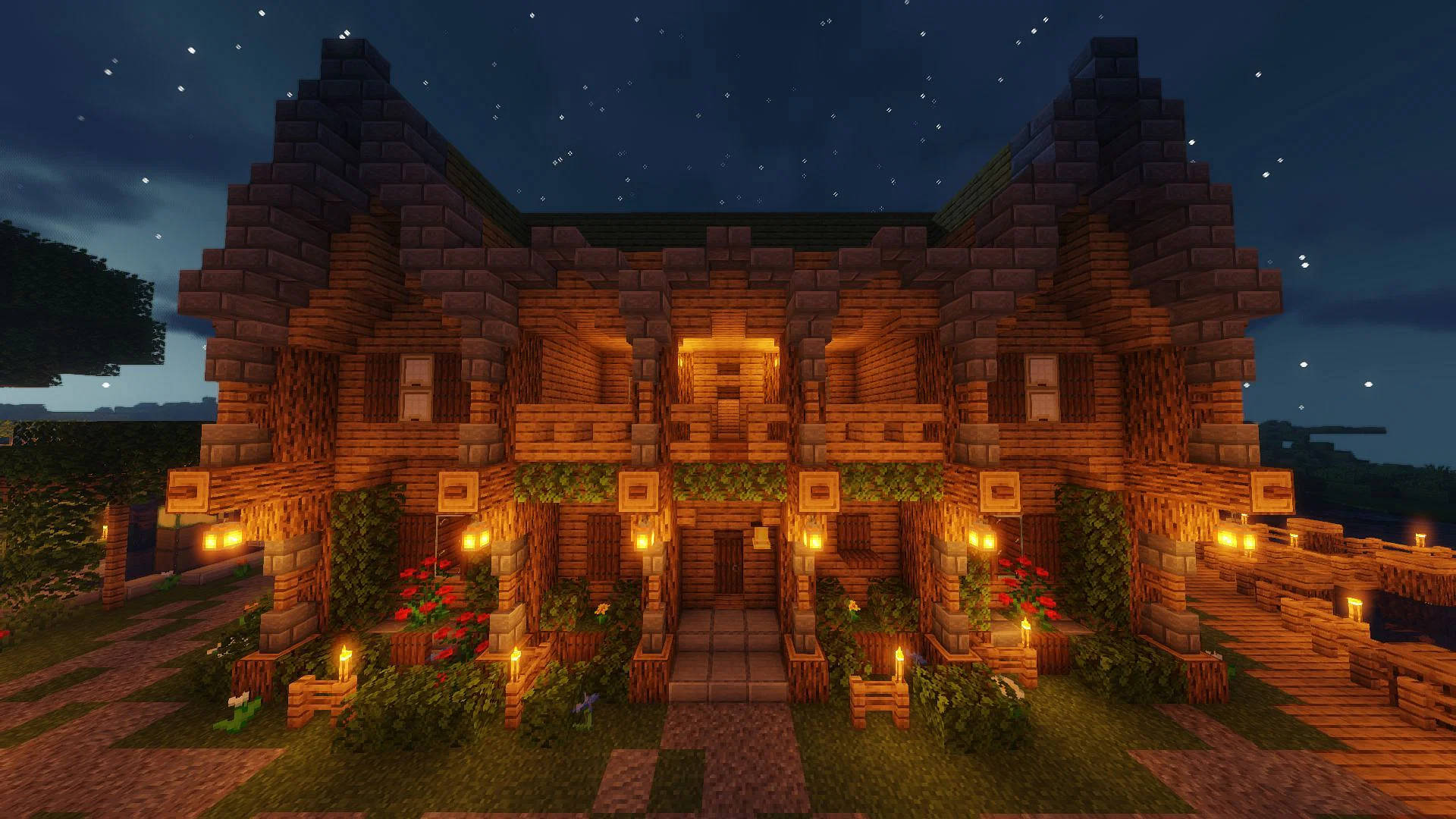 舒適的Minecraft屋在星空下被燈籠照亮。