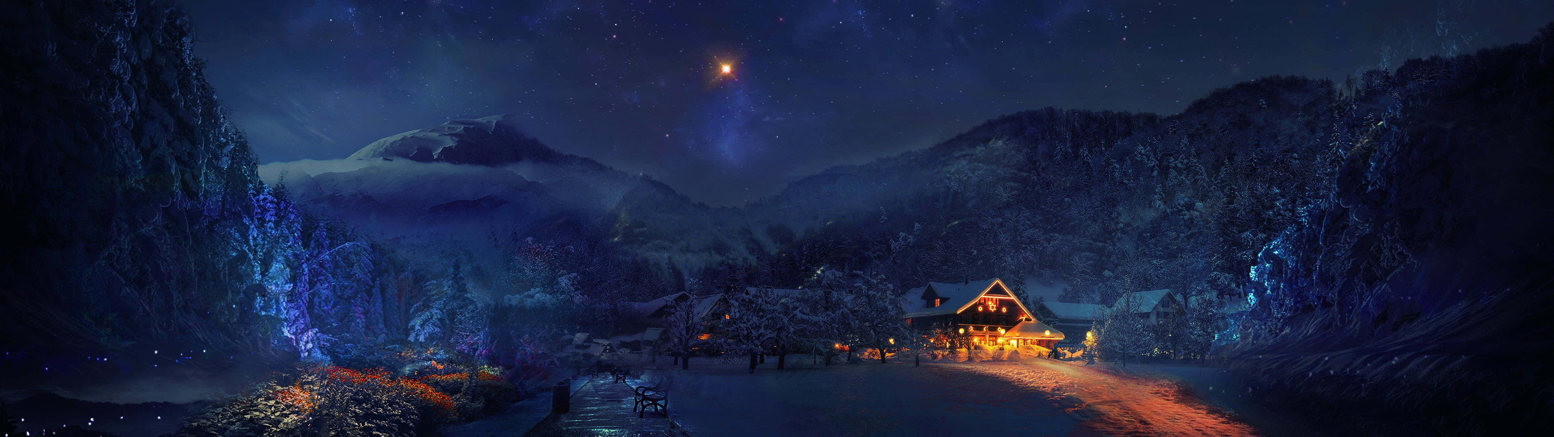 5120x1440 Dual Screen 桌布 壁紙 — 一間舒適的小屋在繁星點點的夜空下溫暖地發光，遠處有積雪覆蓋的山脈和發光的藍色樹木。