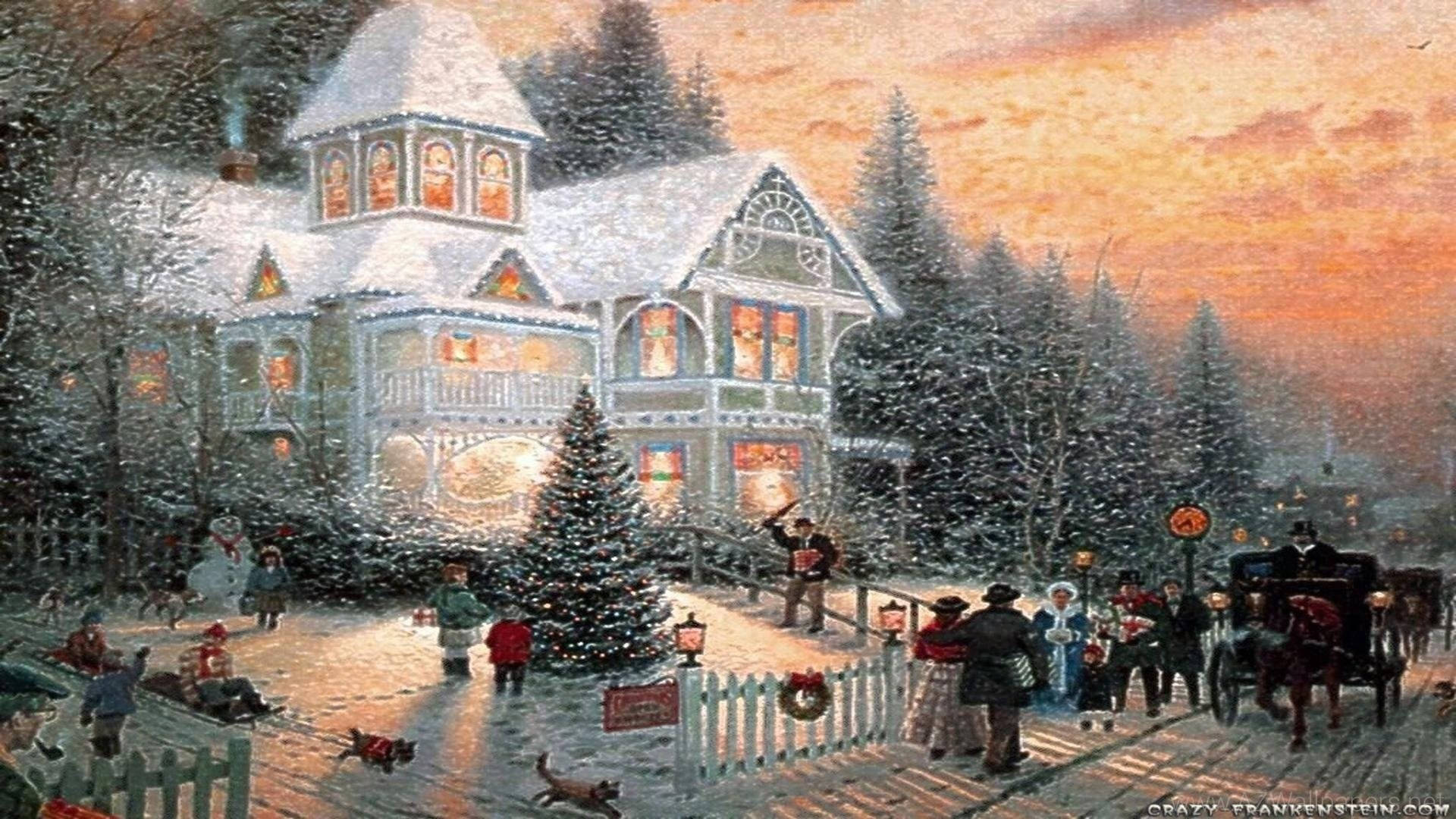 Scenes 桌布 壁紙 — 一間被雪覆蓋的維多利亞式房屋溫暖地發光，人們在黃昏時分聚集在節日冬季村莊中一棵裝飾好的樹周圍。