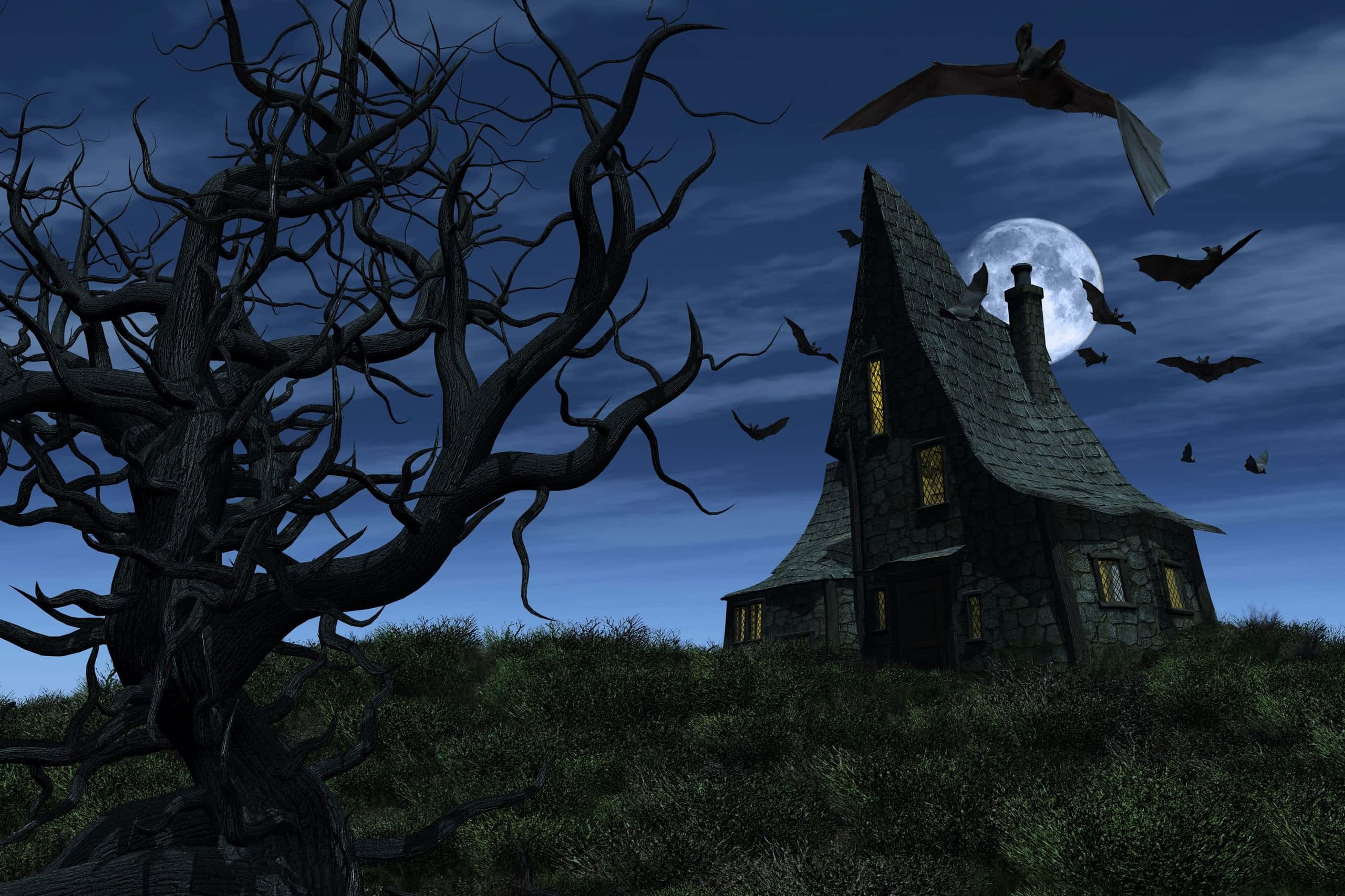 Spooky Halloween 桌布 壁紙 — 一間陰森的石屋在滿月下矗立，窗戶發光，蝙蝠圍繞著一棵扭曲的枯樹飛舞。