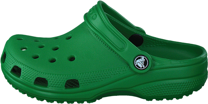 Crocs 桌布 壁紙 — 一隻亮綠色 Croc 木屐鞋孤立在黑色背景上，具有可見紋理和通風孔。