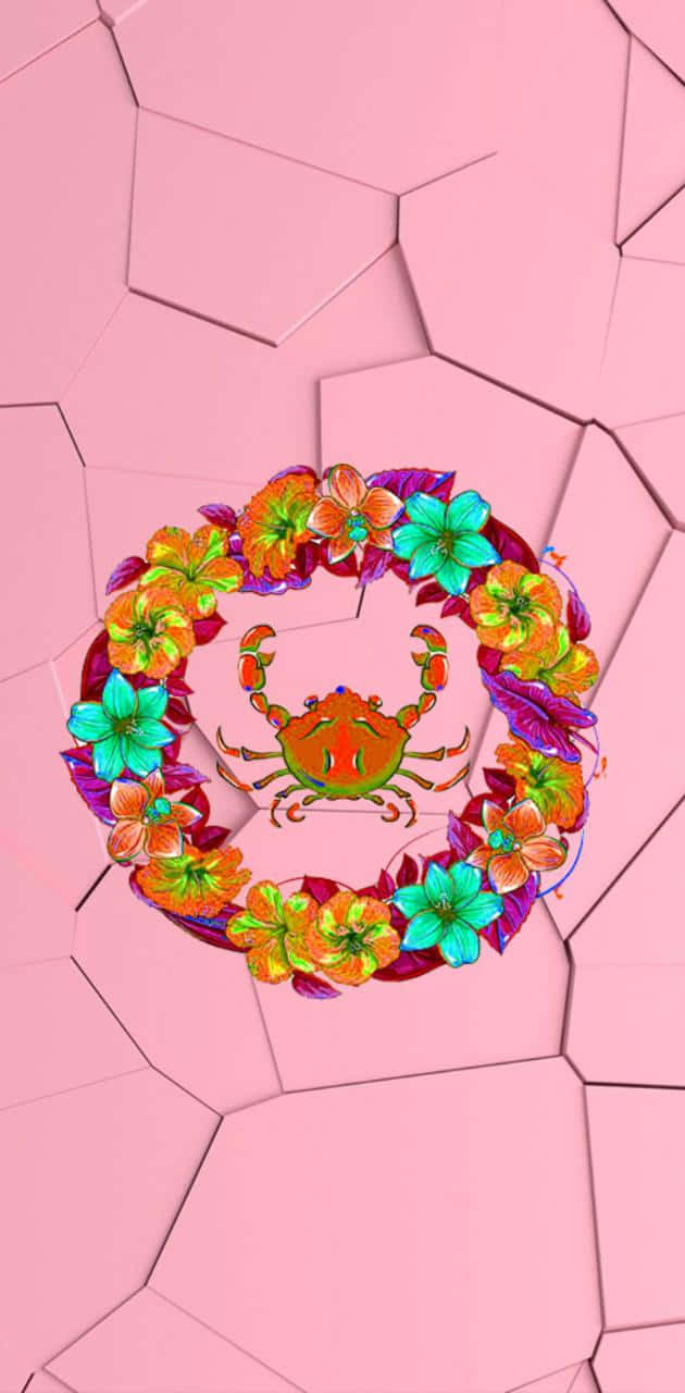 Cancer Zodiac Sign 桌布 壁紙 — 一隻充滿活力的卡通蟹，被色彩繽紛的花環環繞，背景是粉紅色幾何圖案。