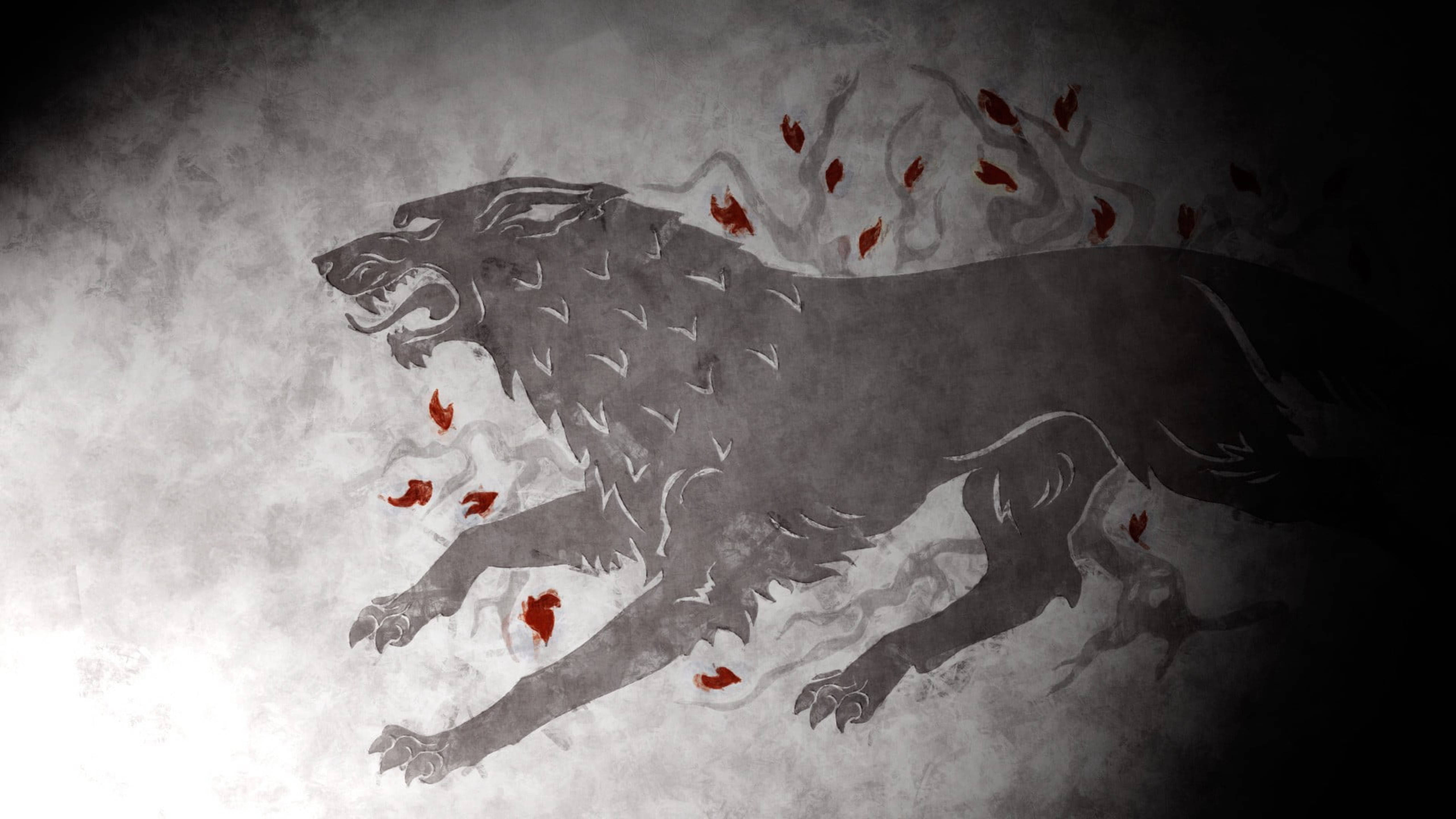 House Stark 桌布 壁紙 — 一隻兇猛的灰狼帶有紅色葉狀標記，在煙霧繚繞的紋理背景上撲躍。