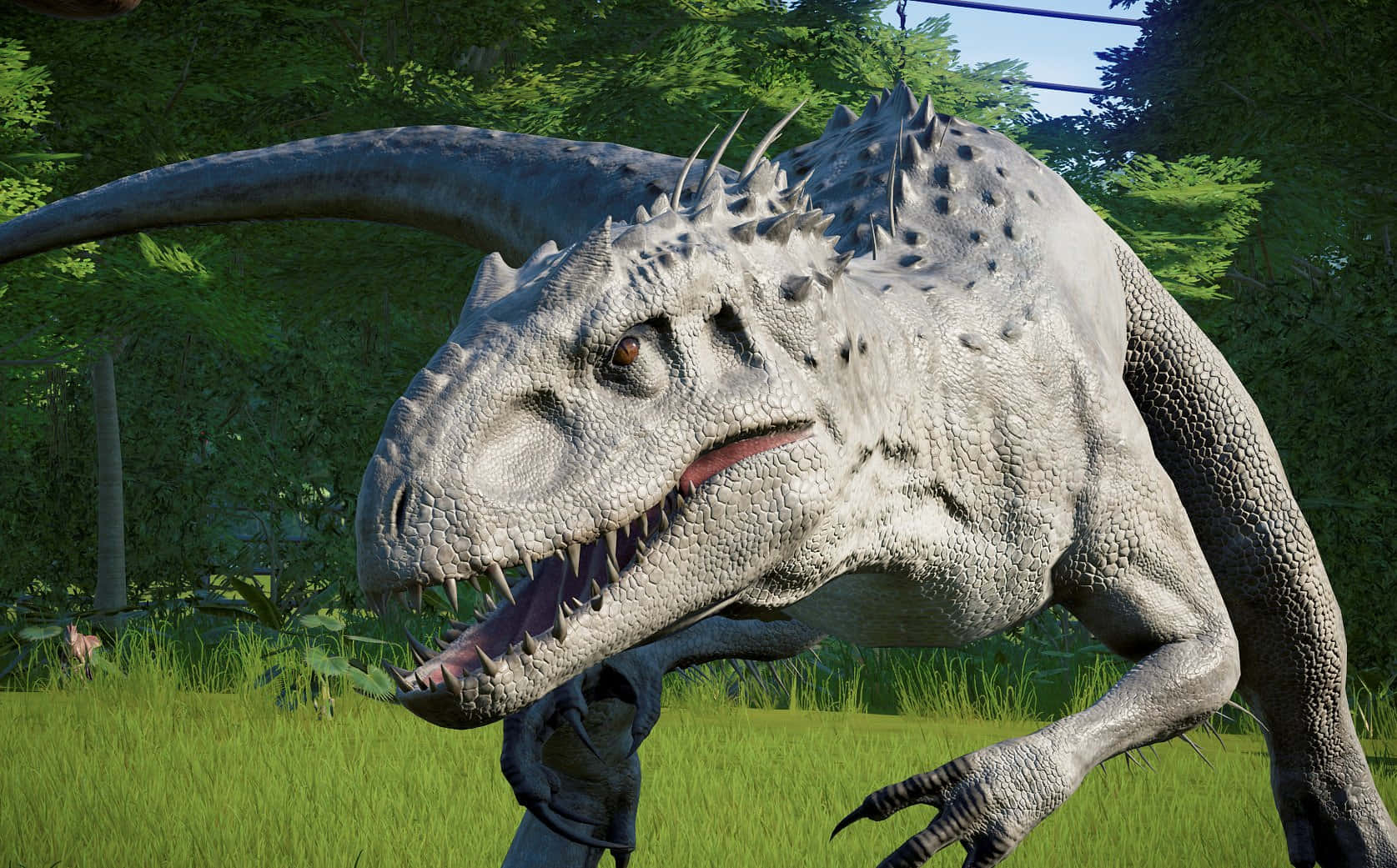 Jurassic World 桌布 壁紙 — 一隻兇猛的灰色獸腳類恐龍，背上有尖刺和鋒利的牙齒，在陽光明媚的綠色森林中潛行。