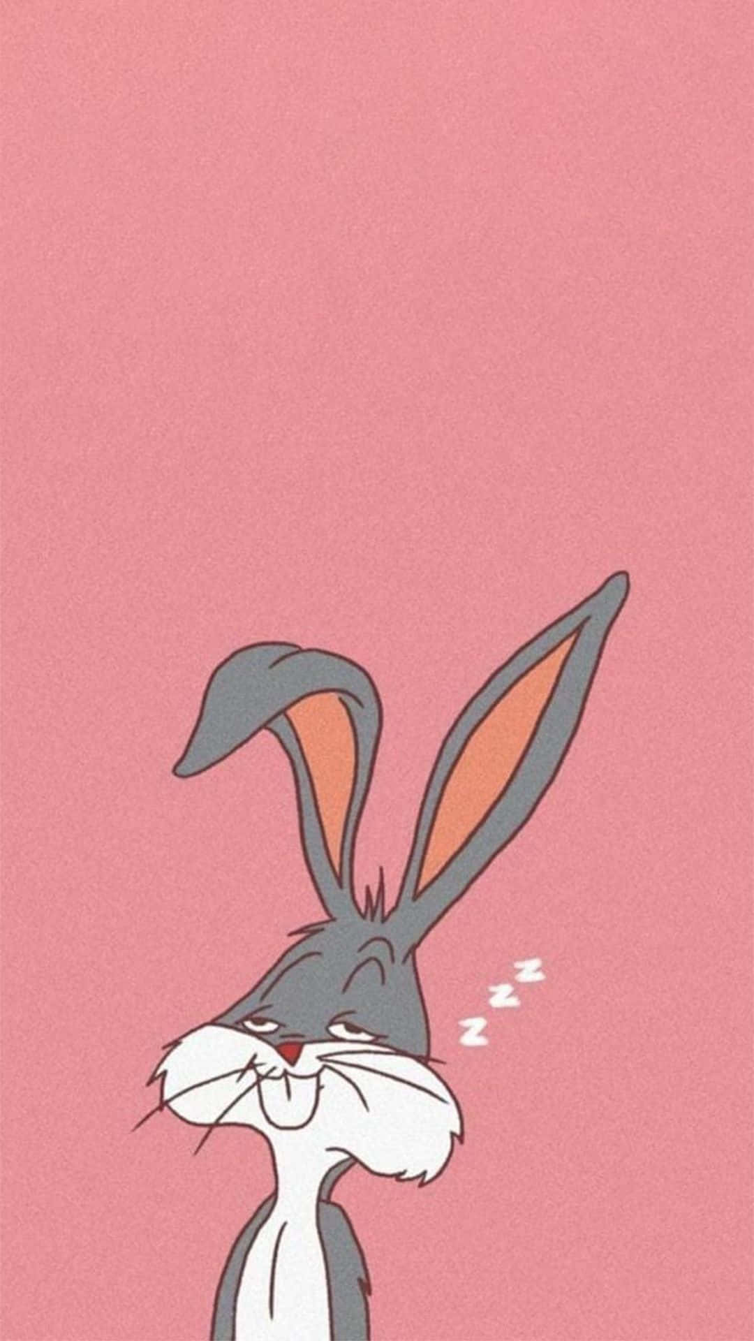 Bugs Bunny iPhone 桌布 壁紙 — 一隻卡通兔在純粉紅色背景上安詳地睡覺，頭旁邊有zzz漂浮。