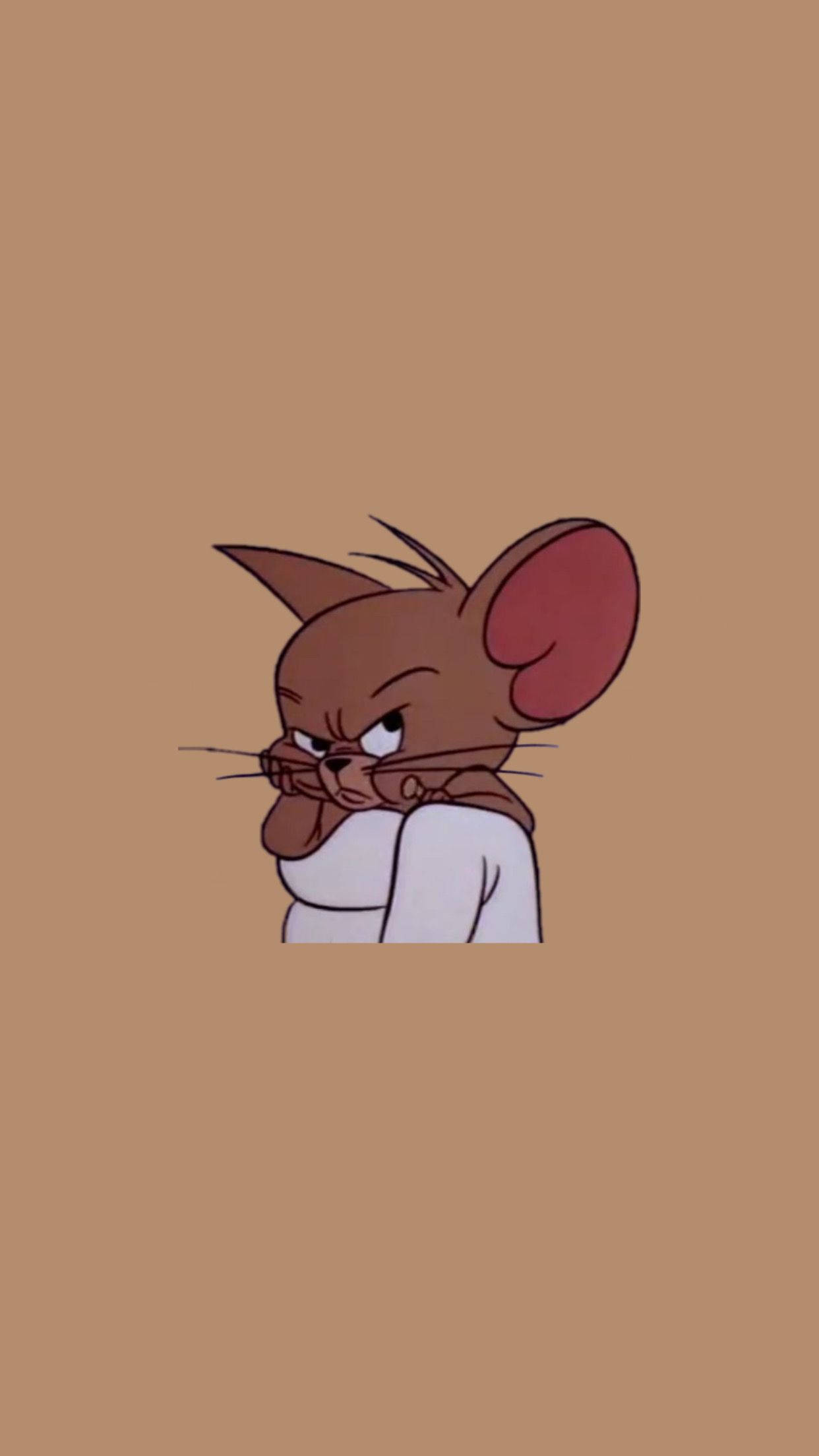 Jerry 桌布 壁紙 — 一隻卡通老鼠帶著憤怒的表情，在純棕色背景上從白色物體後面探出頭來。