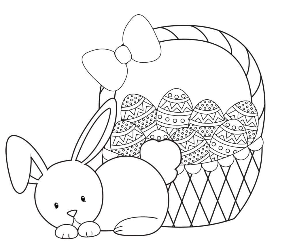 Easter Bunny 桌布 壁紙 — 一隻可愛的兔子在一個裝滿圖案復活節蛋並飾有蝴蝶結的籃子旁邊休息。