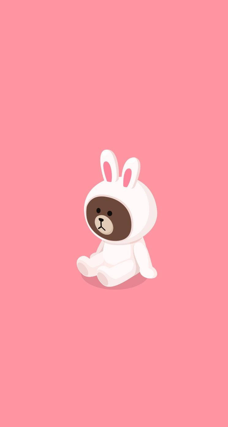 Line 桌布 壁紙 — 一隻可愛的卡通熊穿著白色兔子服裝，獨自坐在純粉紅色背景前。
