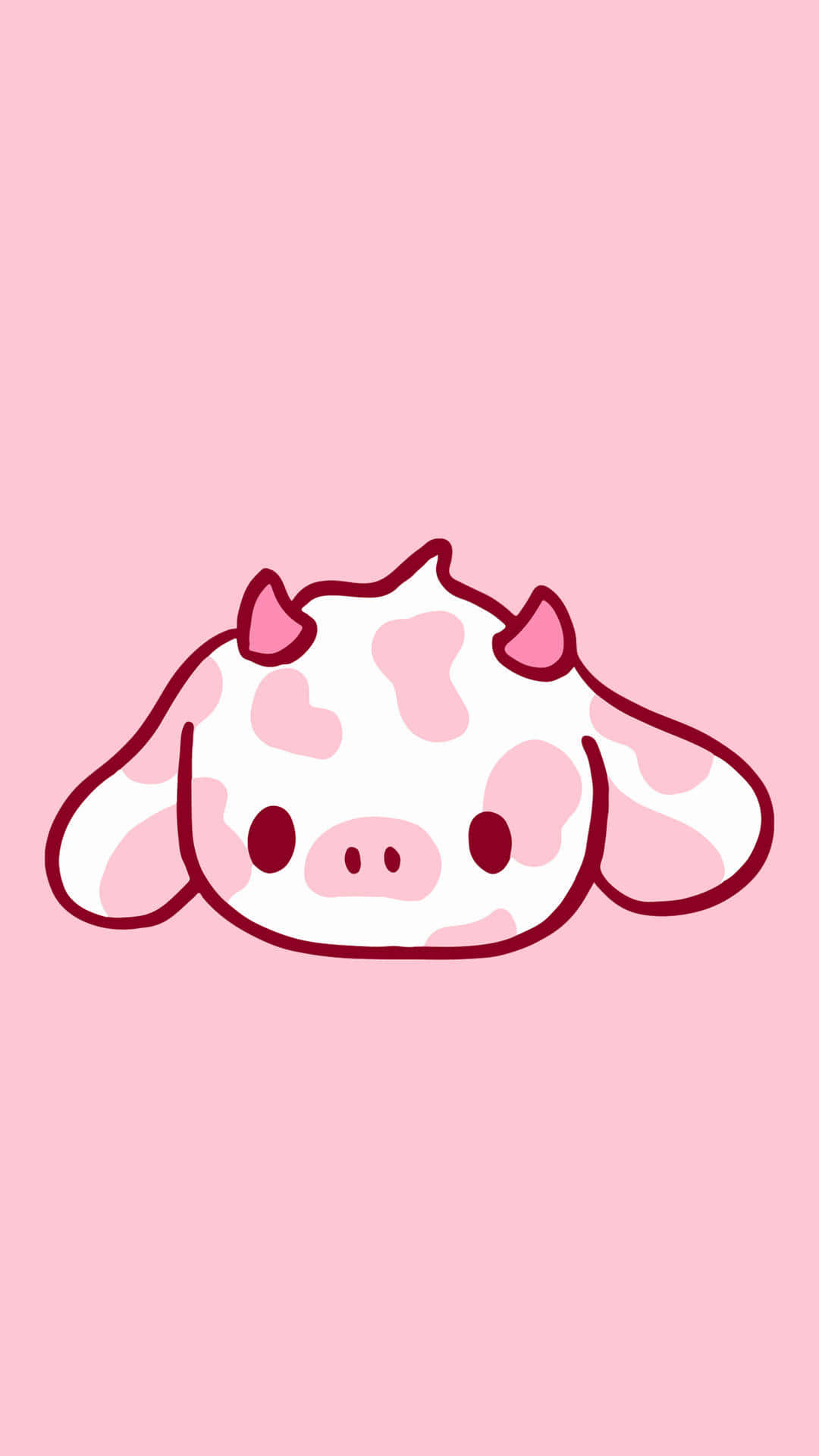 Strawberry Cow 桌布 壁紙 — 一隻可愛的卡通牛，帶有粉紅色斑點和小角，躺在柔軟的粉紅色背景上。