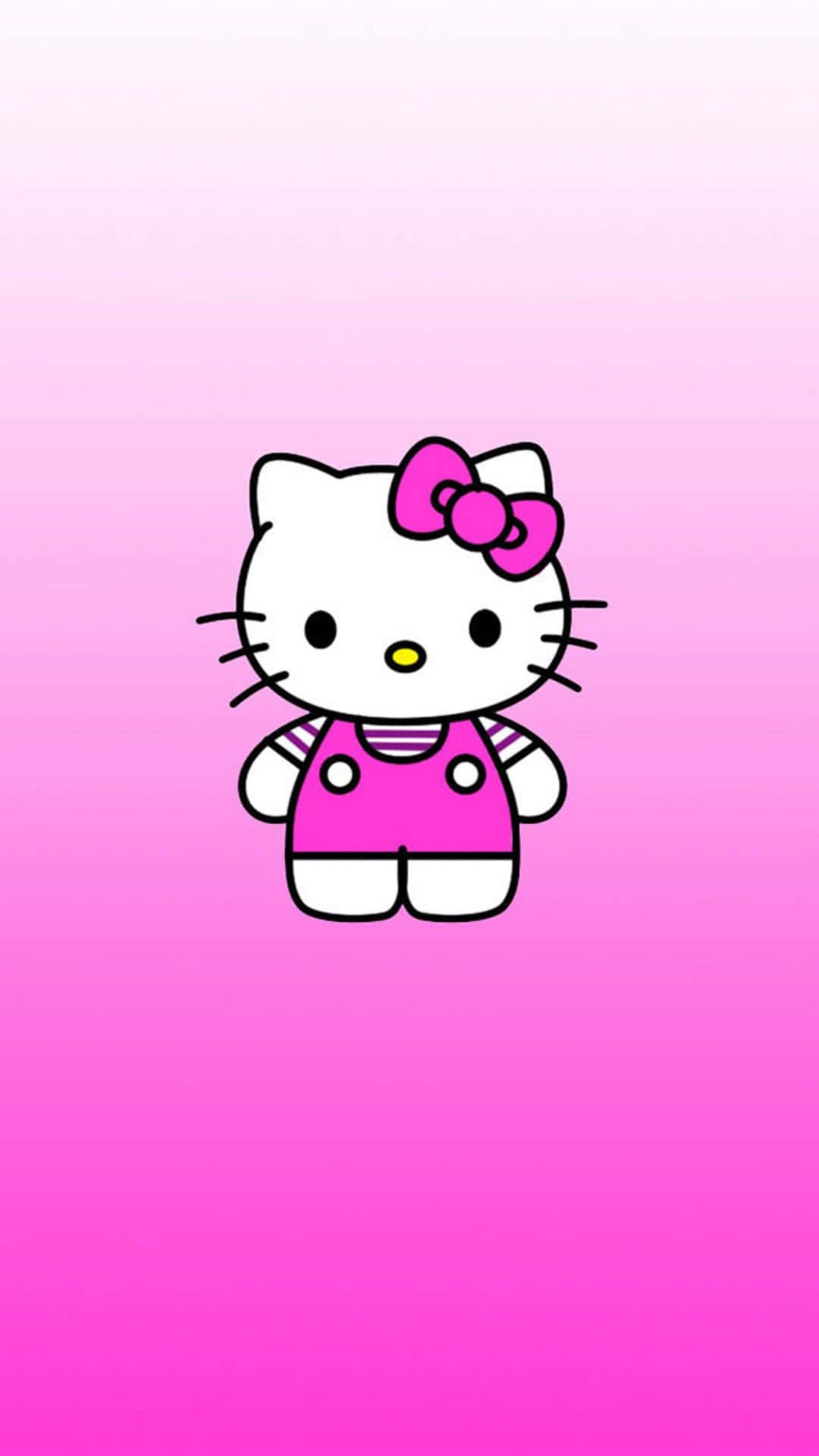 Hello Kitty 桌布 壁紙 — 一隻可愛的卡通貓咪，戴著粉紅色蝴蝶結和穿著吊帶褲，站在柔和的粉紅色漸變背景中央。