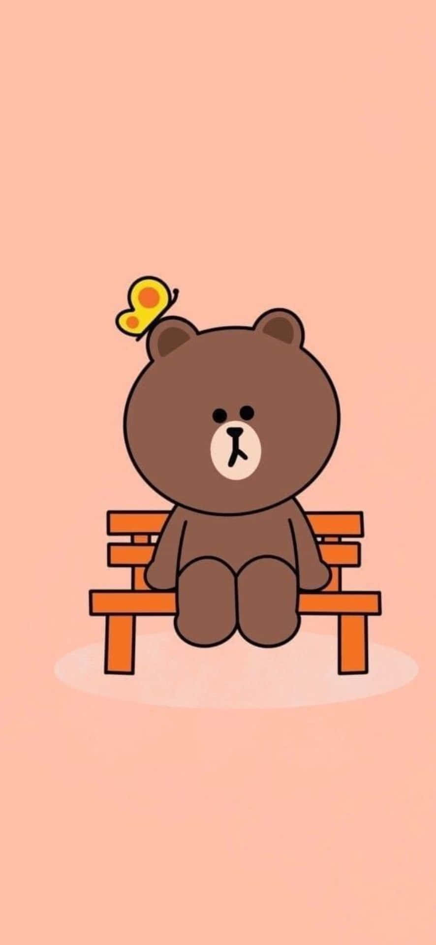 一隻卡通熊坐在長椅上，頭上有一隻蝴蝶。 — 卡通 iPhone 壁紙 壁紙