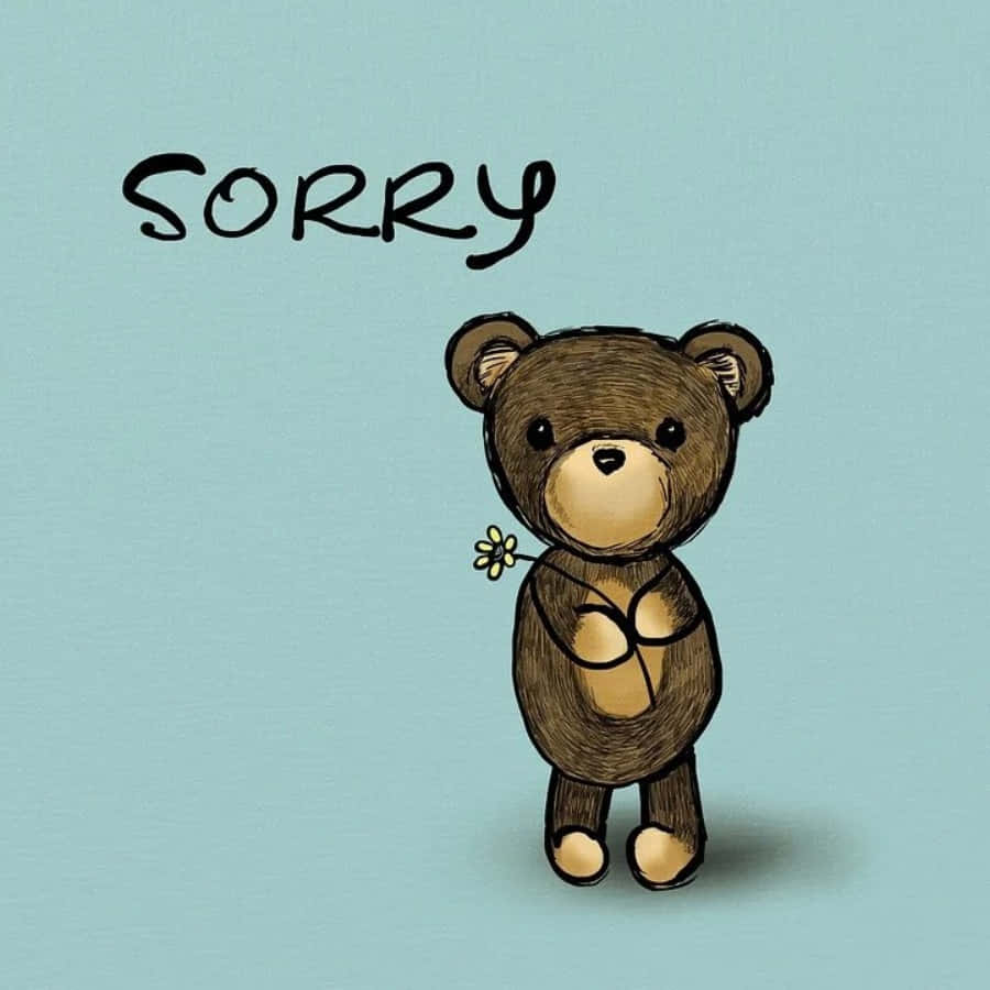 Teddy Bear 桌布 壁紙 — 一隻可愛的棕色泰迪熊拿著一朵小花，站在柔和的藍色背景前，上方寫著「SORRY」。