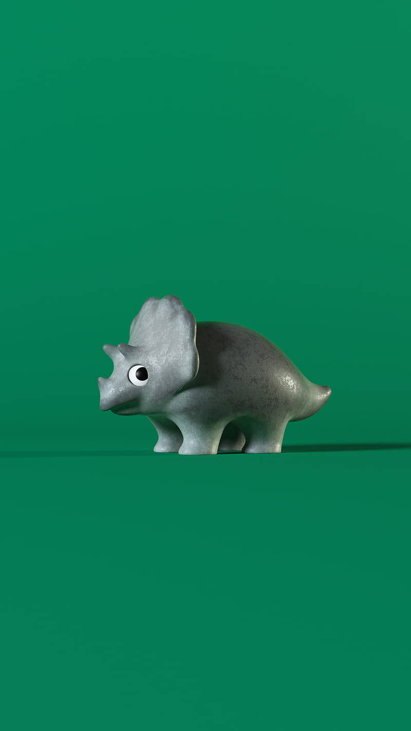 Funny Dinosaur 桌布 壁紙 — 一隻可愛的灰色三角龍公仔，大眼睛，獨自站在純綠色背景前。