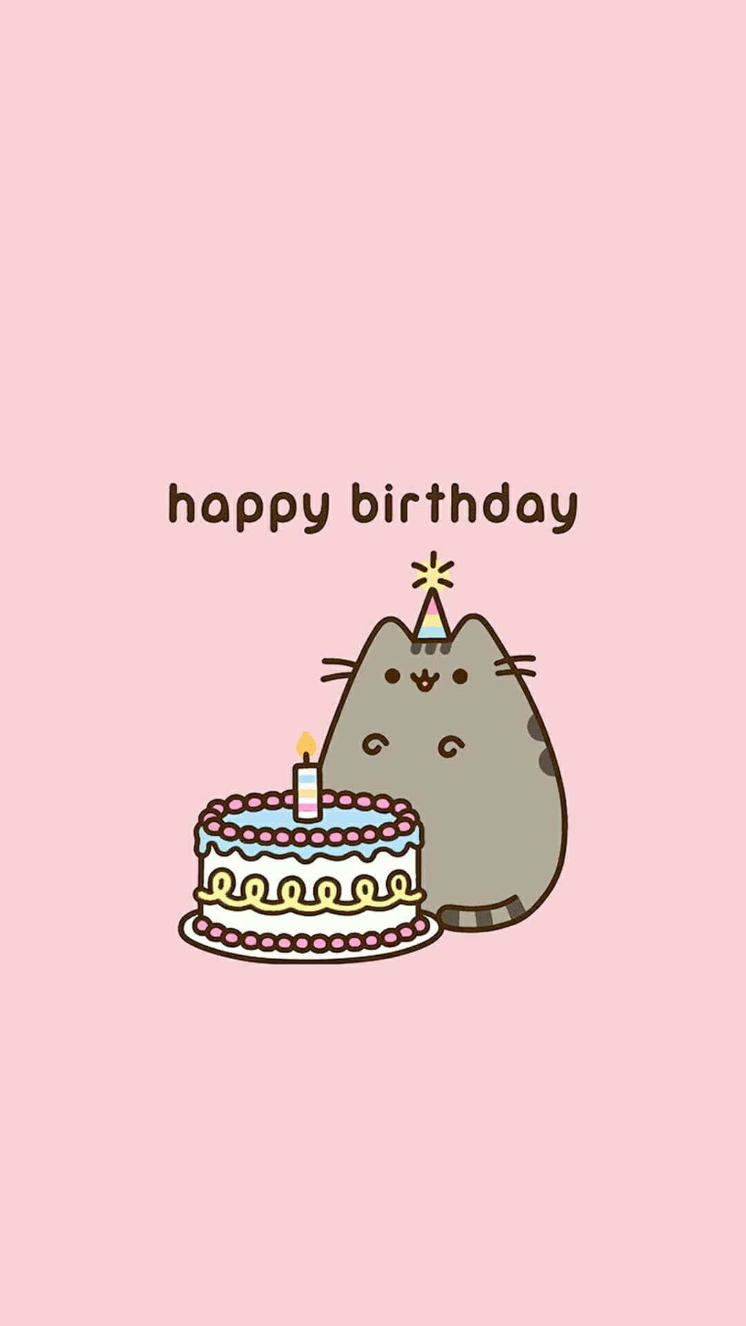 Birthday Cake 桌布 壁紙 — 一隻可愛的灰色貓咪戴著派對帽，坐在柔軟粉紅色背景上、插著一根蠟燭的生日蛋糕旁邊。
