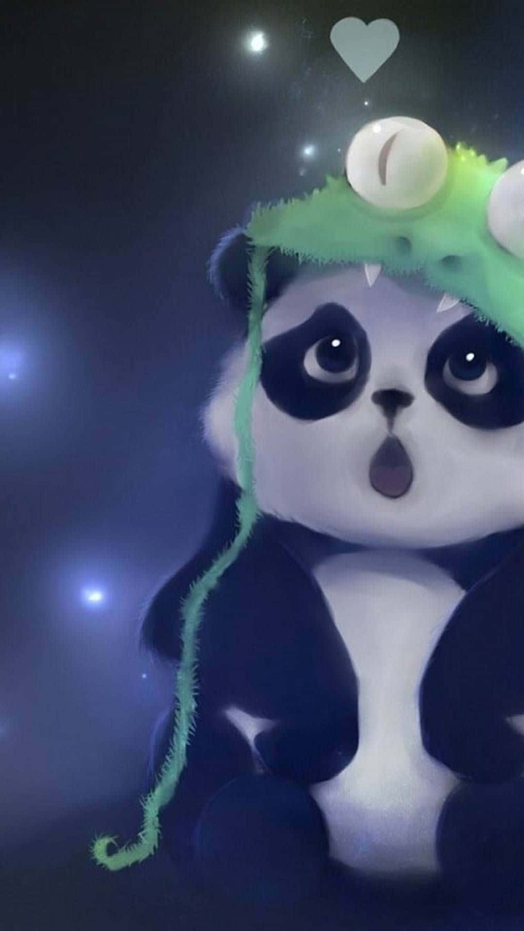 桌布 壁紙 — 一隻可愛的熊貓戴著綠色怪物帽，帽上有眼睛和尖牙，在星空下顯得驚訝，上方漂浮著一顆心。