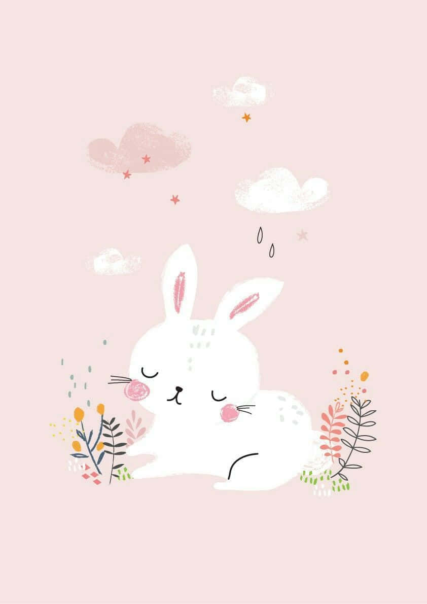 Kawaii Bunny 桌布 壁紙 — 一隻可愛的白兔在柔和的粉紅色背景上，於粉彩雲朵和色彩繽紛的樹葉中安然入睡。