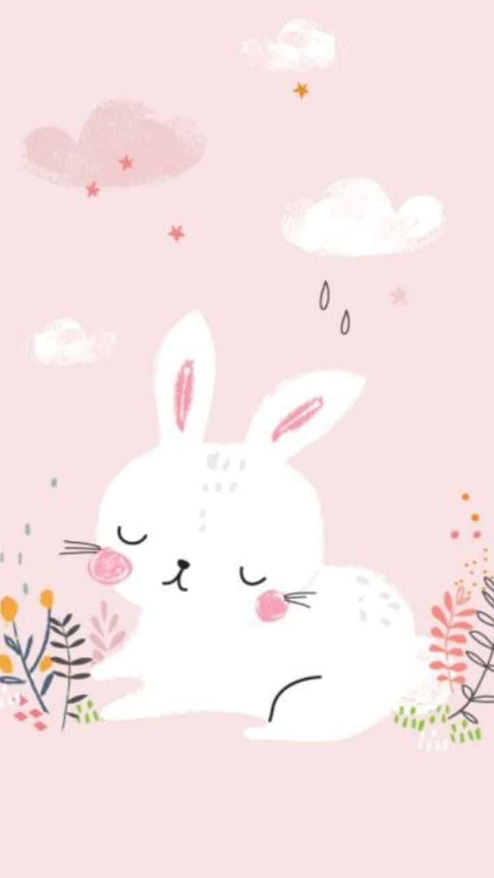 Pink Bunny 桌布 壁紙 — 一隻可愛的白兔閉著眼睛，在柔和的粉紅雲朵和星星下，於色彩繽紛的植物間安詳地休息。