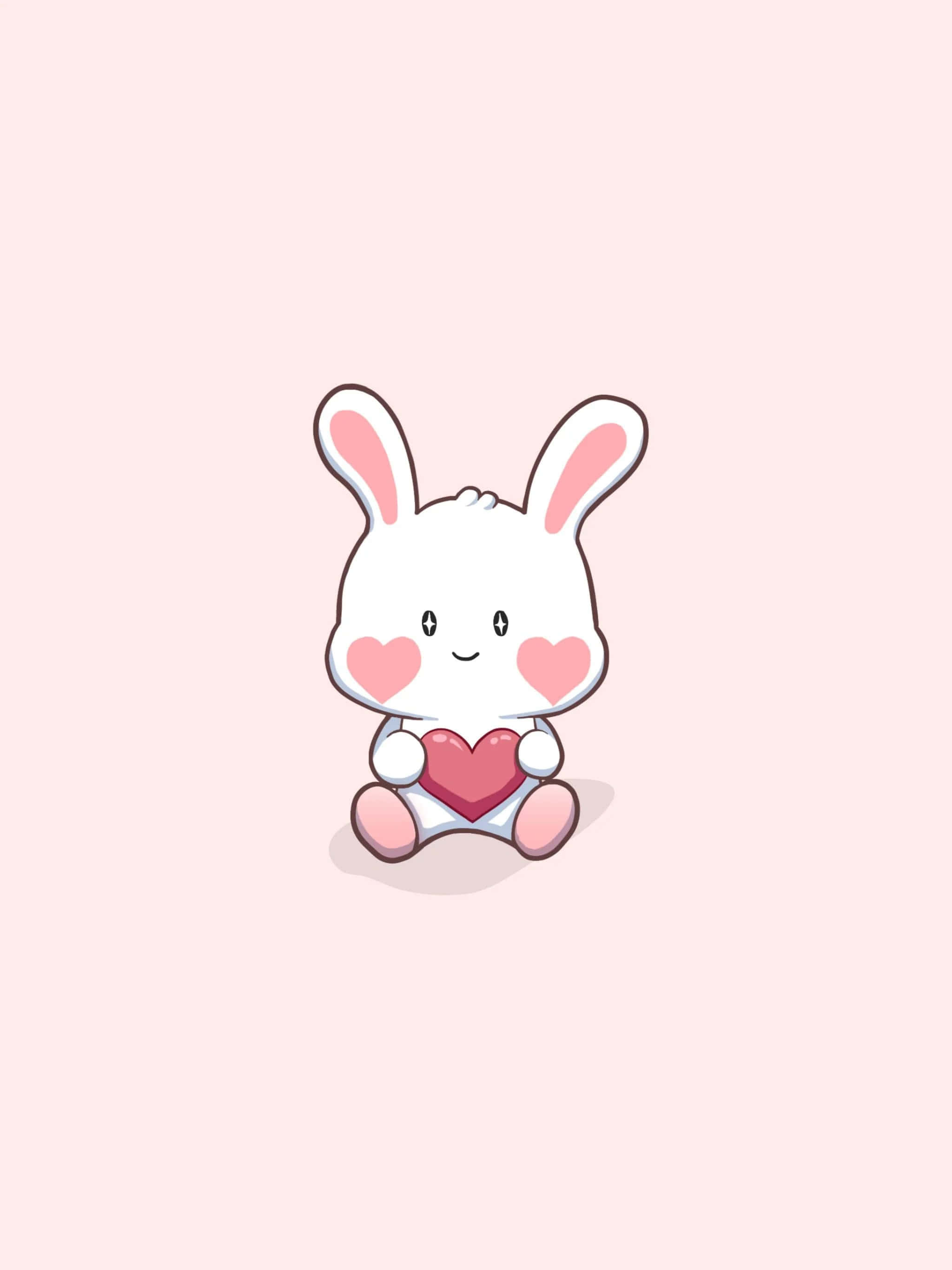 Cartoon Heart 桌布 壁紙 — 一隻可愛的白色卡通兔子，有粉紅色臉頰和耳朵，在柔和的粉紅色背景上拿著一個紅色愛心。