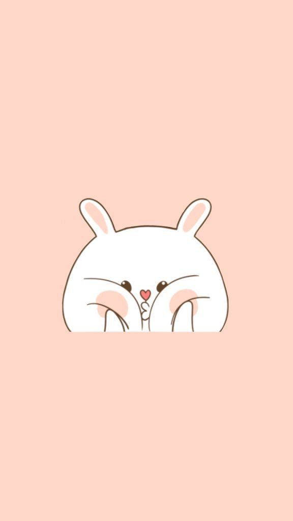 cute girly phone 桌布 壁紙 — 一隻可愛的白色卡通兔子從頂部探出頭來，臉頰粉紅，有個細小的心形鼻子，背景是柔和的桃色。