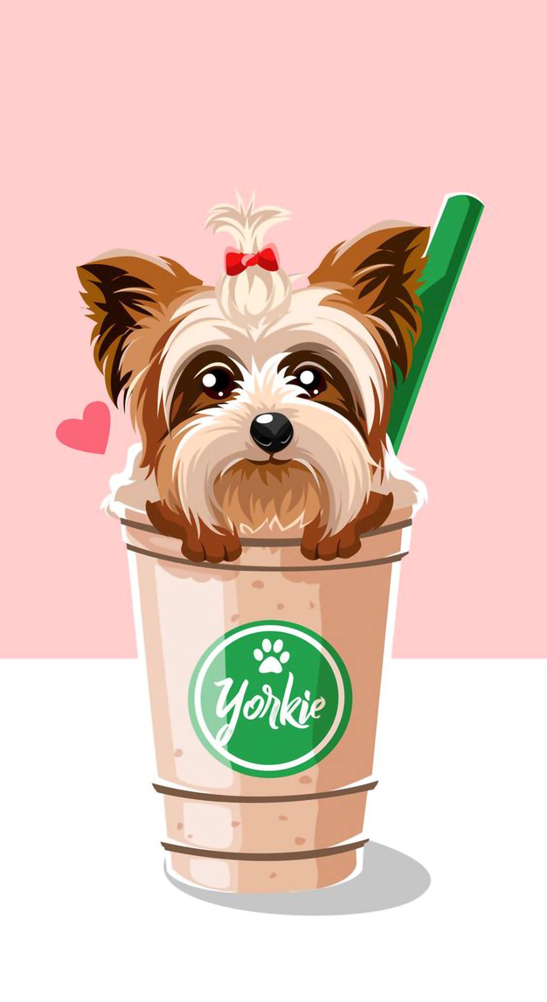 yorkie 桌布 壁紙 — 一隻可愛的約克夏㹴幼犬，戴著紅色蝴蝶結，從一個有綠色吸管的品牌飲料杯中探出頭來，背景是柔和的粉紅色。