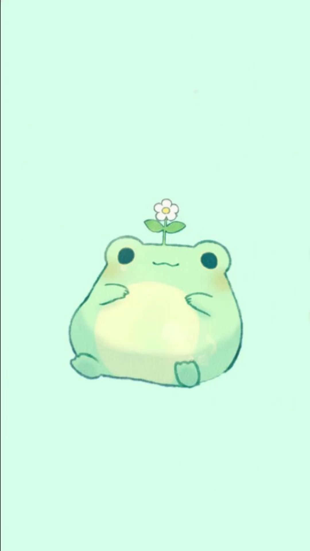 Frog 桌布 壁紙 — 一隻可愛的綠色青蛙，頭上有一朵小白花，靜靜地坐在柔和的薄荷色背景前。
