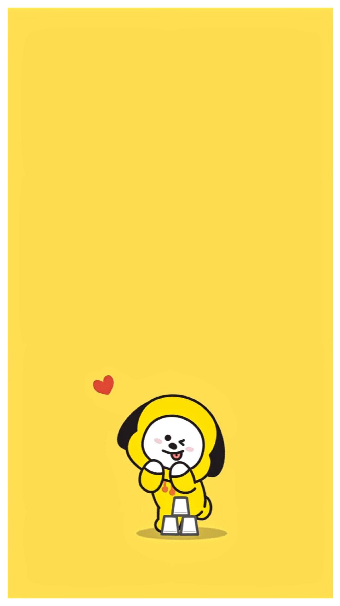 Chimmy 桌布 壁紙 — 一隻可愛的黃色卡通狗，黑色耳朵，微笑著，在純黃色背景上拿著一個小紅心。