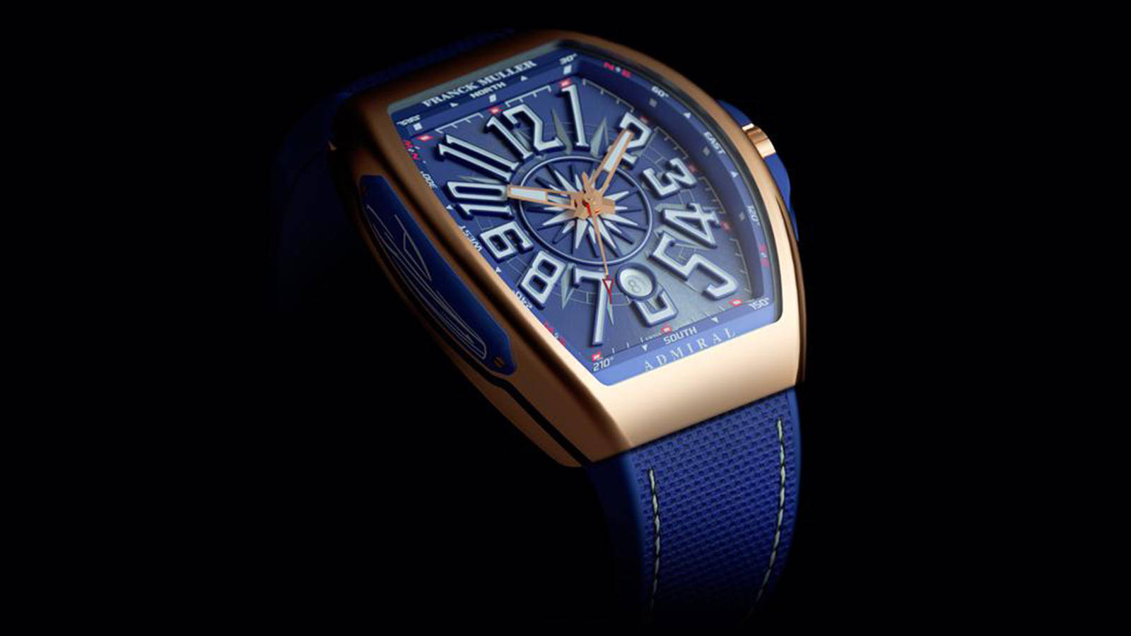 藍色 桌布 壁紙 — 一隻奢華的Franck Muller Admiral手錶，金色錶殼和藍色錶帶在黑色背景上閃耀。