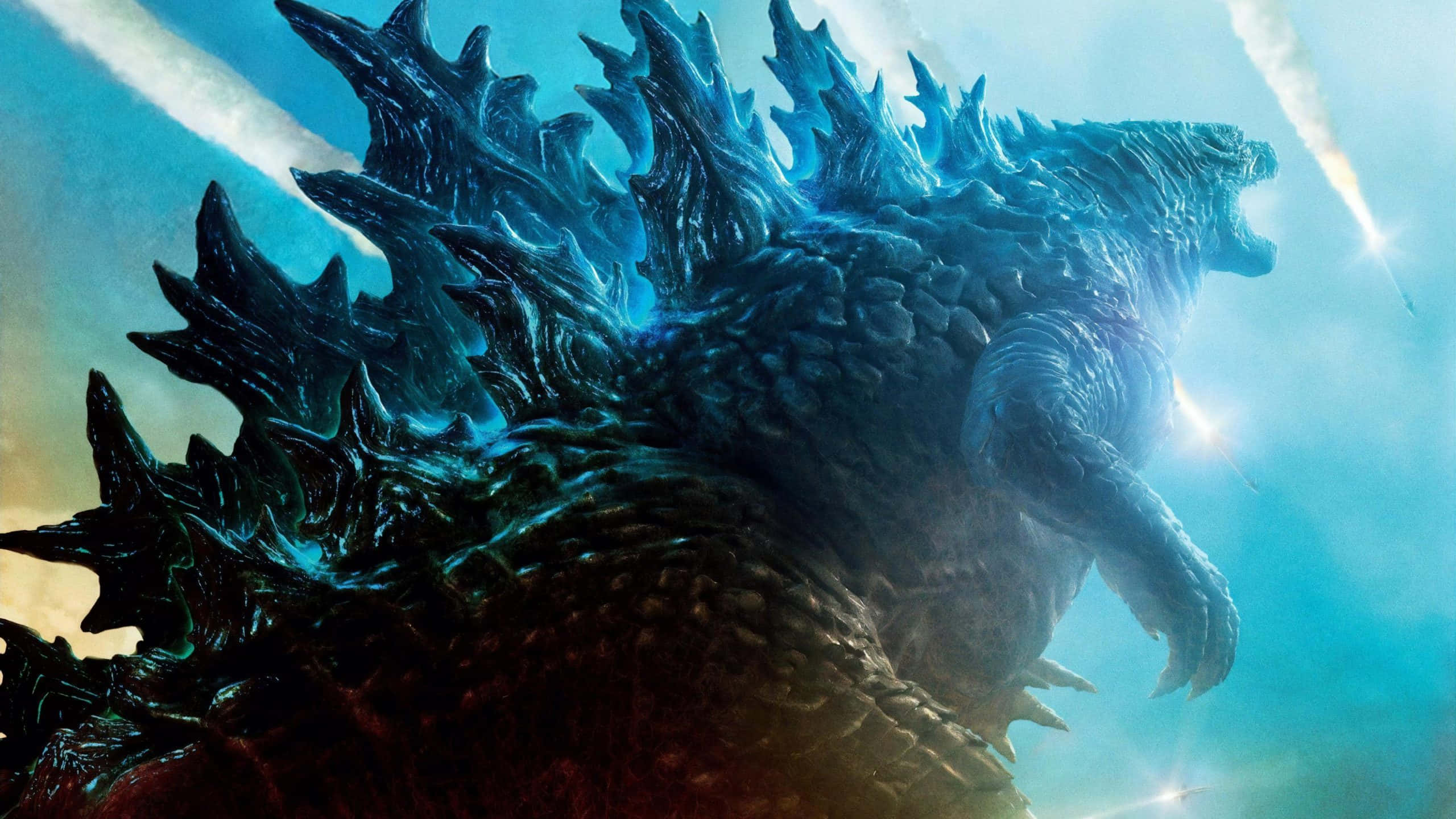 monsters 桌布 壁紙 — 一隻巨大的哥吉拉在佈滿光跡的明亮天空中咆哮，背鰭發出藍光。