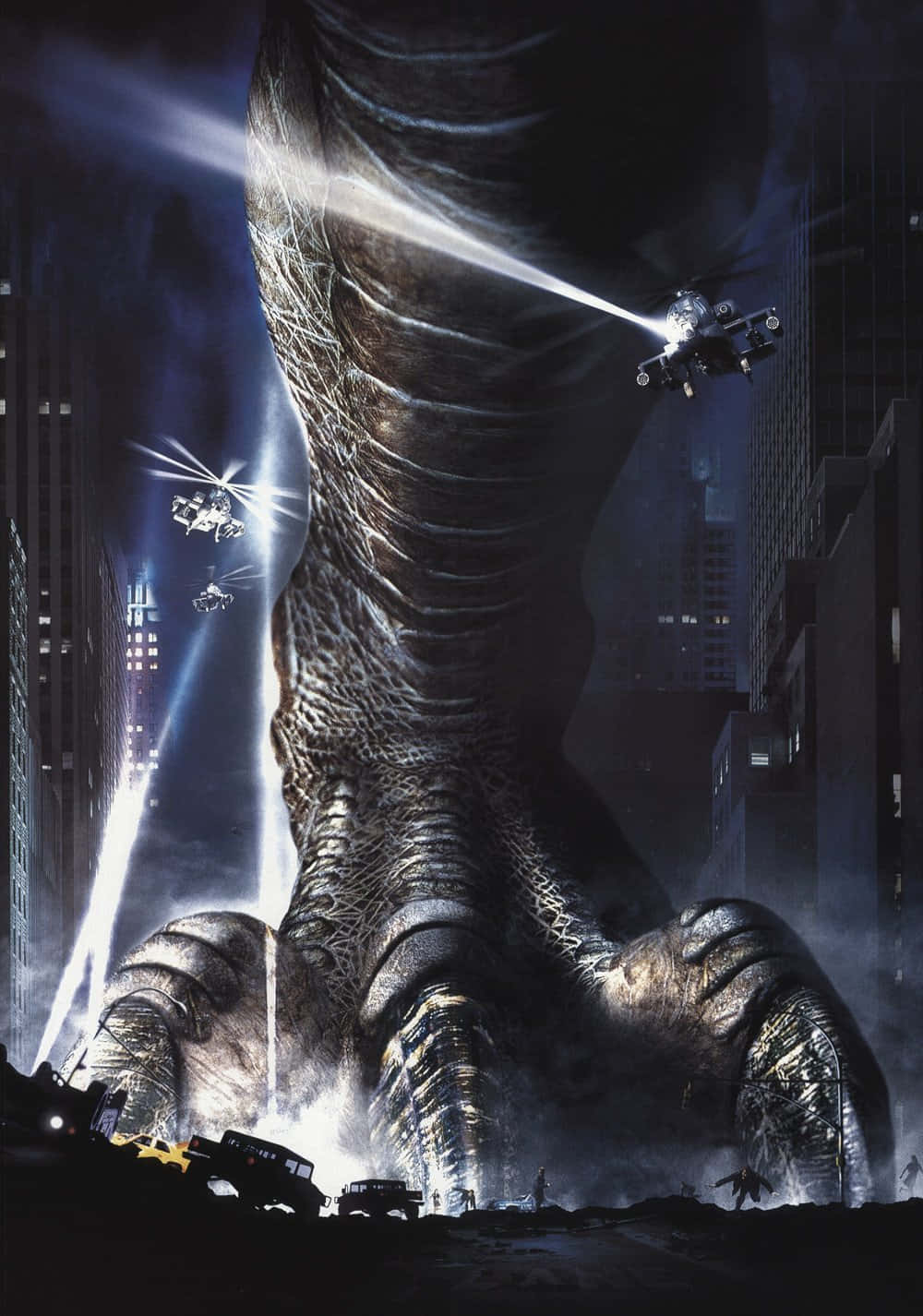 godzilla 1998 桌布 壁紙 — 一隻巨大的恐龍狀生物在夜間踩踏城市，直升機向其巨大的紋理腿發射光束。