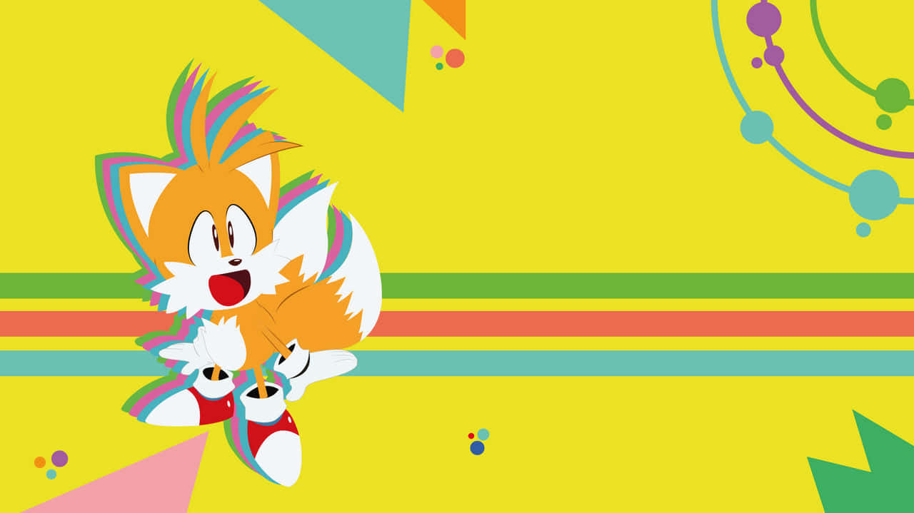 Tails 桌布 壁紙 — 一隻快樂的卡通狐狸，帶有彩虹色尖端，在明亮的黃色背景上，伴隨著色彩繽紛的幾何形狀，歡快地跳躍。