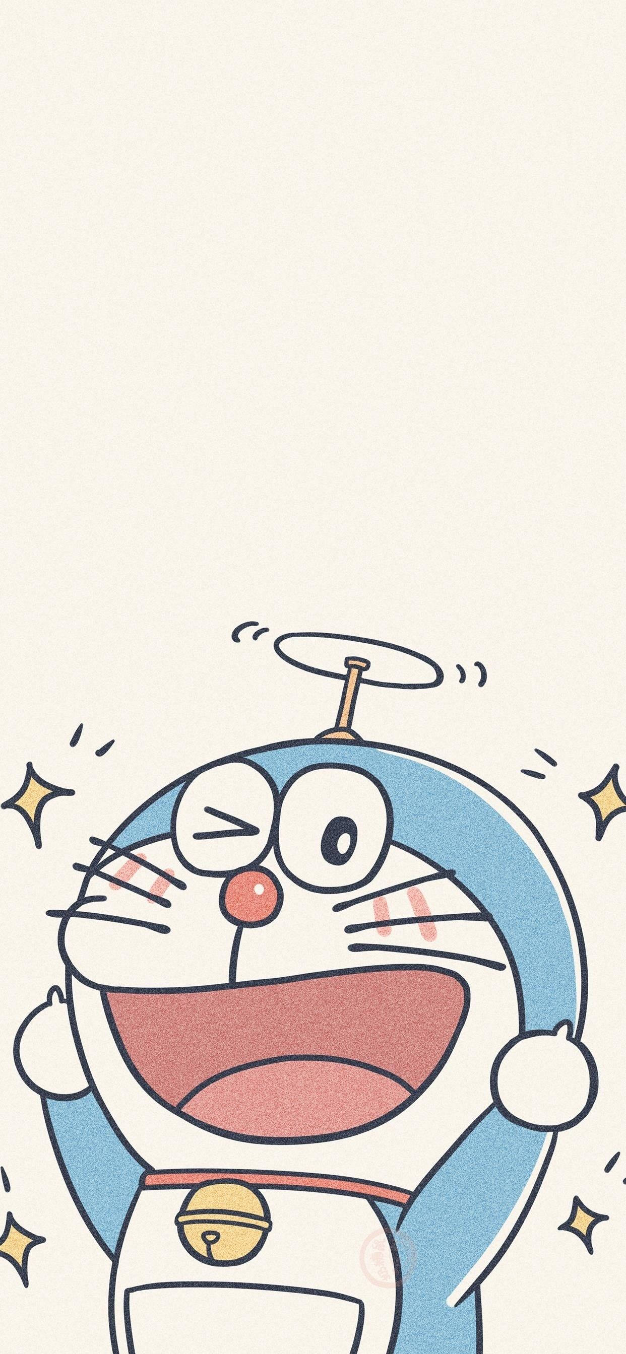 Doraemon 桌布 壁紙 — 一隻快樂的藍色機器貓，帶有旋轉天線和圍繞著它快樂臉龐的星爆。