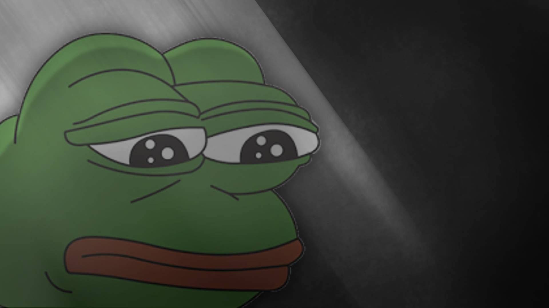 meme 桌布 壁紙 — 一隻憂鬱的綠色青蛙，眼睛下垂，皺著眉頭，在黑暗背景中被聚光燈照亮。