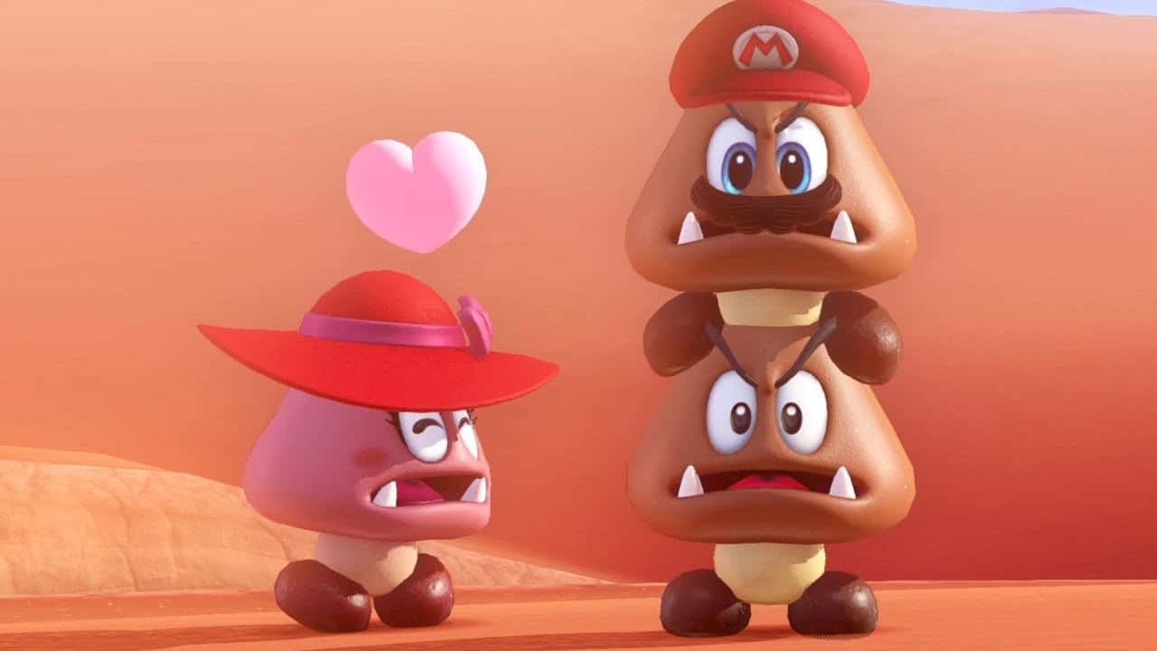 Goomba 桌布 壁紙 — 一隻戴紅帽的粉紅色栗子小子在沙漠景觀中深情地望著疊在一起的兩隻慢慢龜。