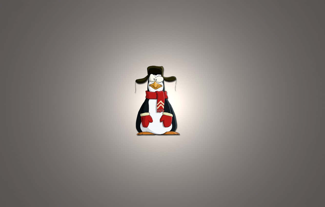 Penguin Tux 桌布 壁紙 — 一隻戴著帽子、圍巾和手套的卡通企鵝，站在柔和的灰色漸變背景中央。