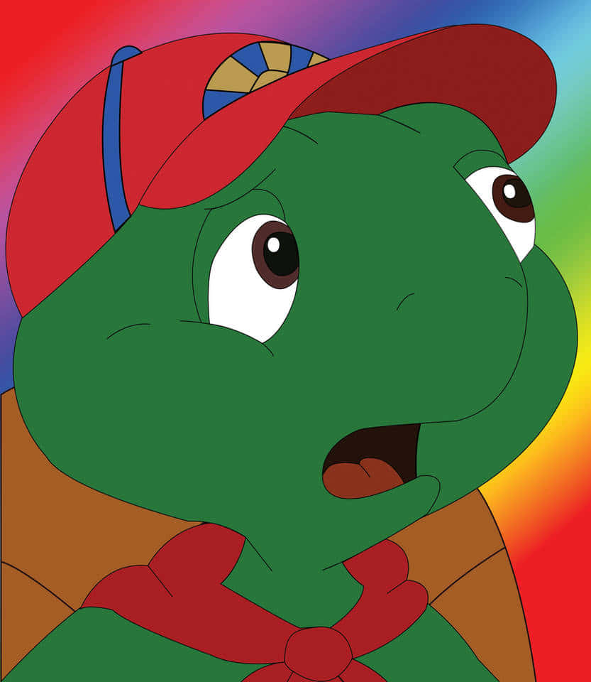 Cartoon Turtle 桌布 壁紙 — 一隻戴著紅色帽子和圍巾的卡通烏龜，在彩虹漸層背景前顯得很驚訝。