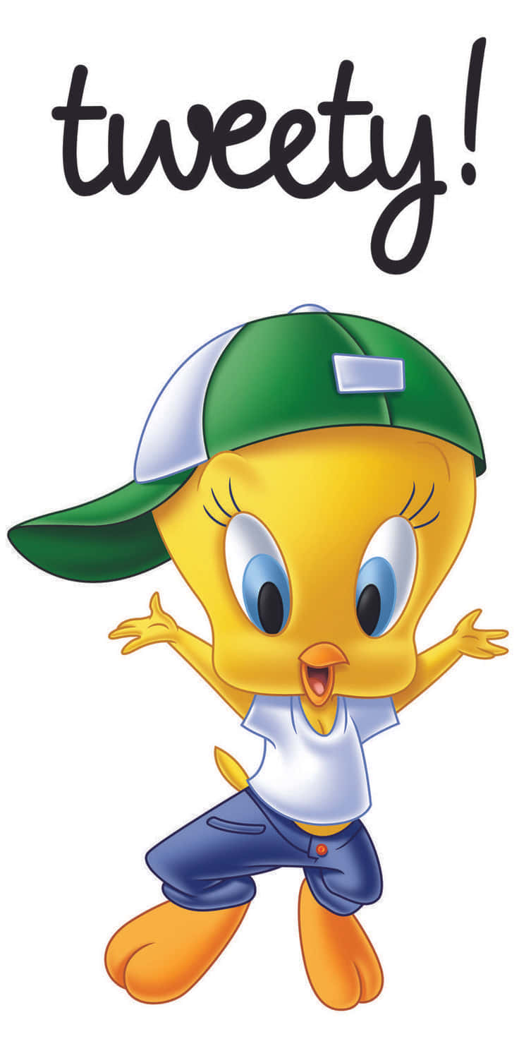 Tweety Bird 桌布 壁紙 — 一隻戴著綠色帽子、白色T恤和藍色牛仔褲的開心卡通小雞，在tweety字樣下張開雙臂跳躍！